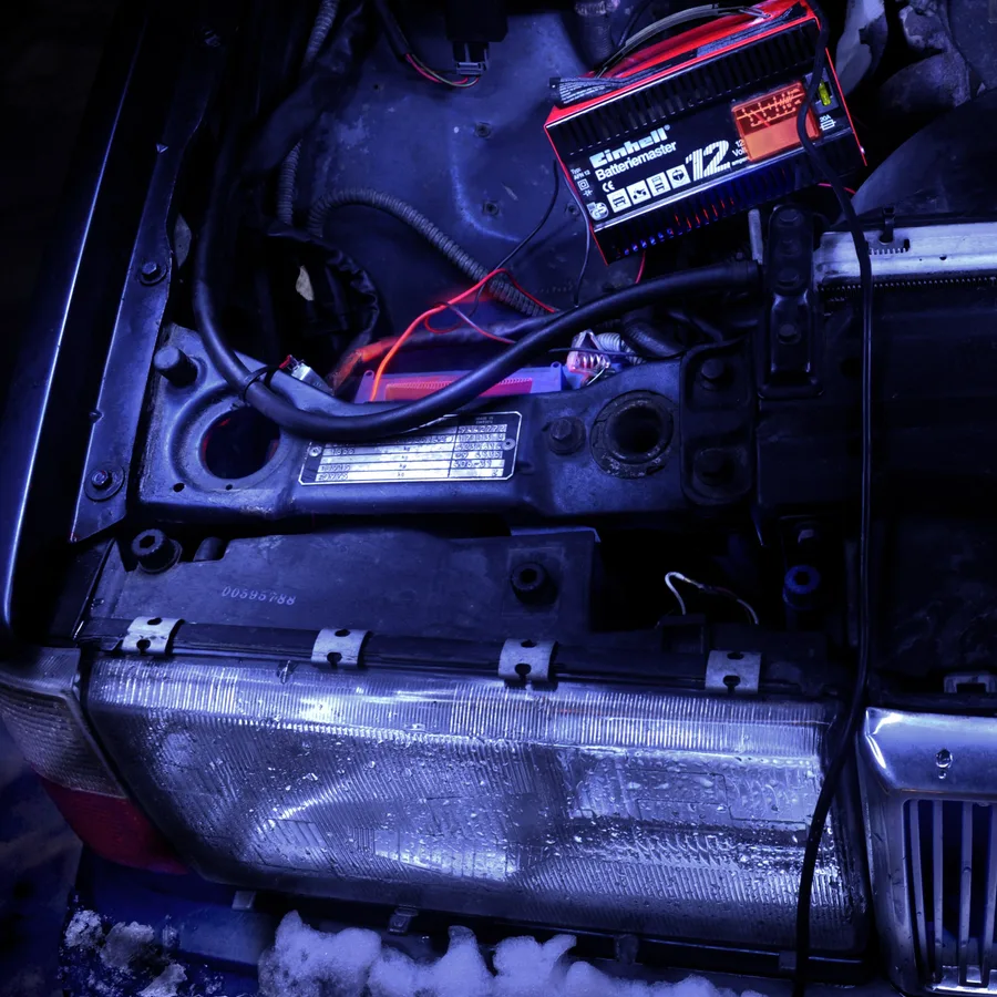 An automotive battery charger and cables shown as a category example.