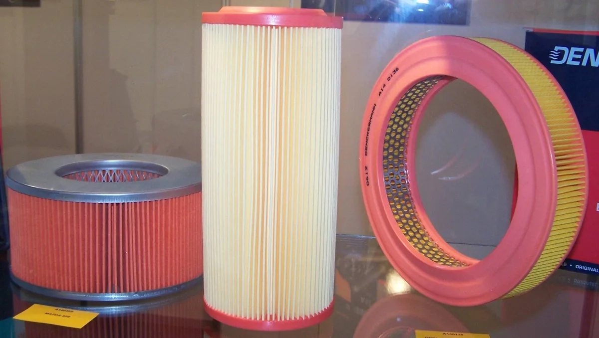 A display of car air filters in different shapes.